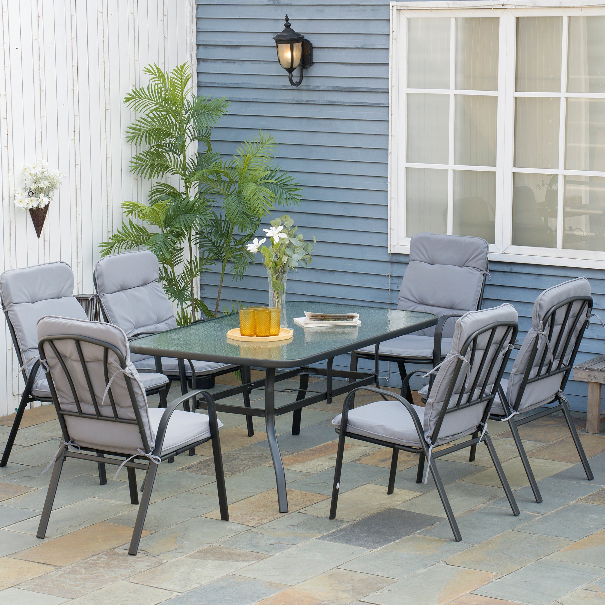 7 Piece Garden Dining Set with Cushioned Armchairs and Tempered Glass Table - Black